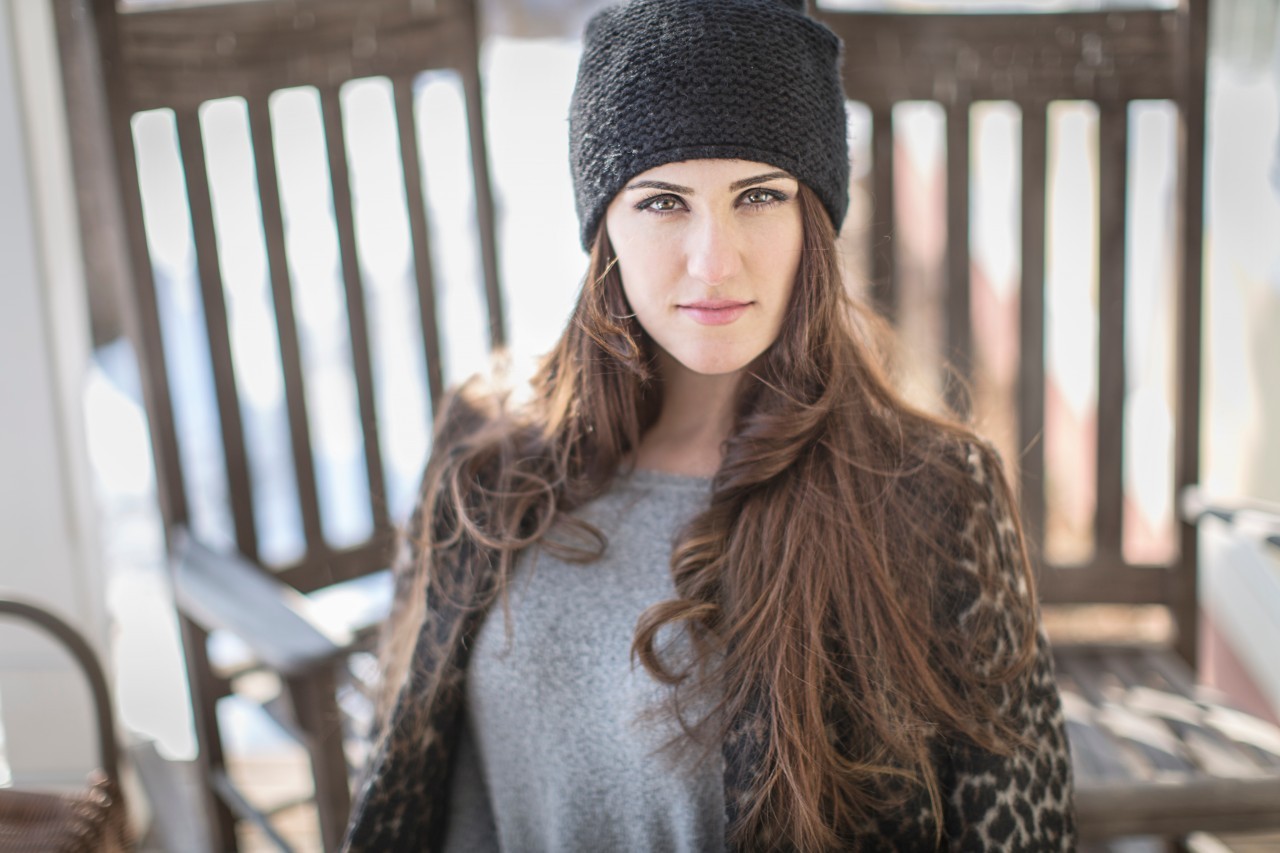 02 Mar 2015 --- Portrait of young woman wearing knit hat --- Image by © Steve Prezant/Corbis