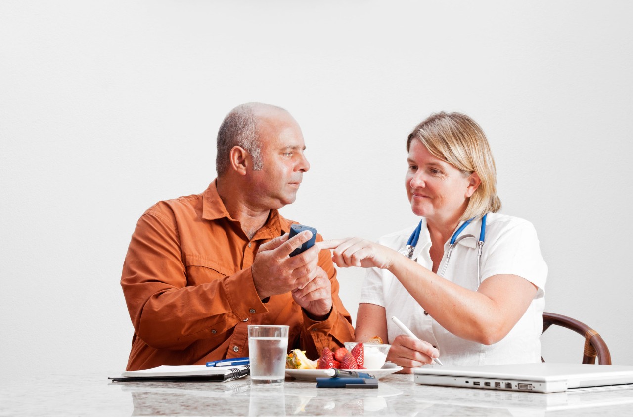 Doctor examining patient's lymph nodes --- Image by © Kate Kunz/Corbis