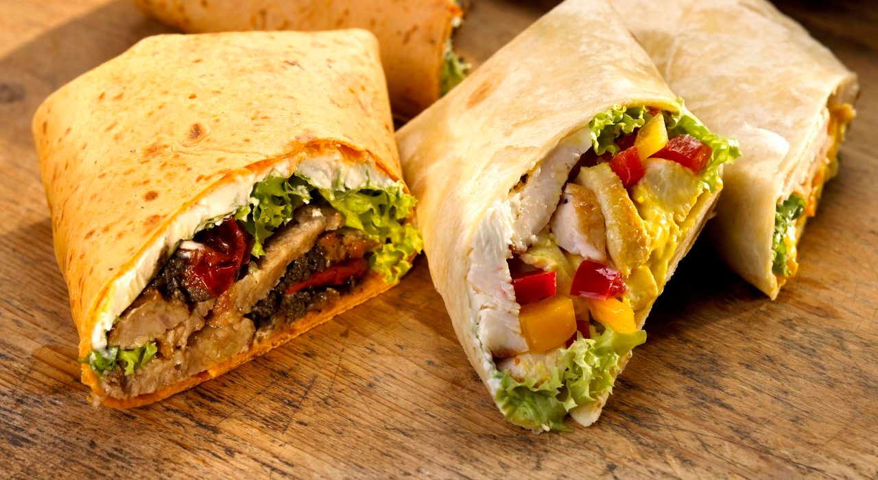 Wraps, filled with chicken --- Image by © Christian Kargl/Westend61/Corbis