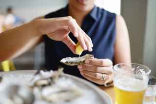 Woman eating an oyster