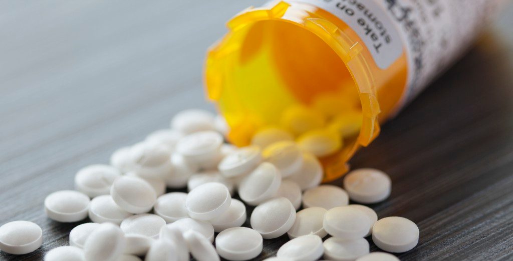 0042-11-30T00:00:00.000Z 10 Apr 2012 --- White pills spilled on table. --- Image by © Hero Images/Corbis