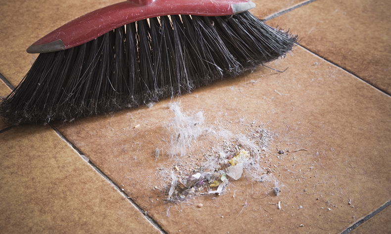Broom and dirt --- Image by © Ken Welsh/Design Pics/Corbis