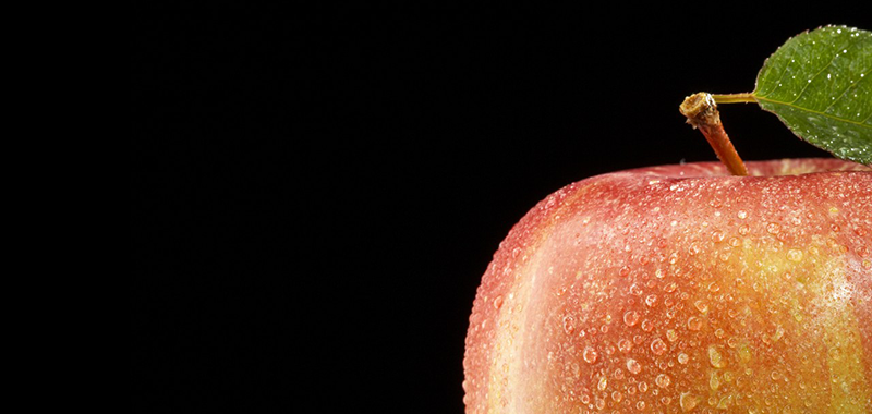 Close-up of apple, studio shot --- Image by © Marc Wuchner/Corbis