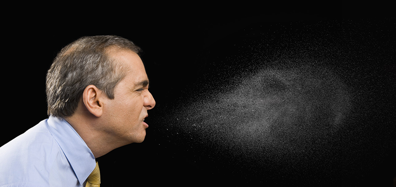 Businessman sneezing --- Image by © John Lund/Blend Images/Corbis