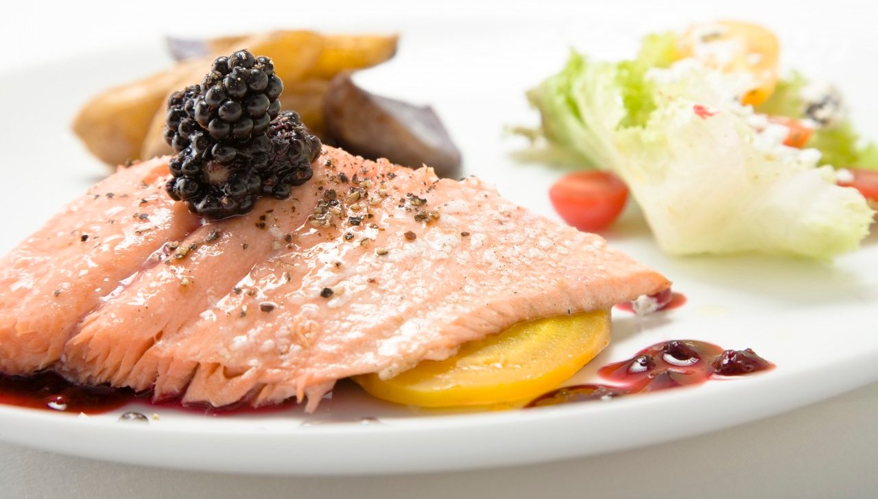 Salmon with blackberries on top --- Image by © Ned Frisk Photography/Corbis