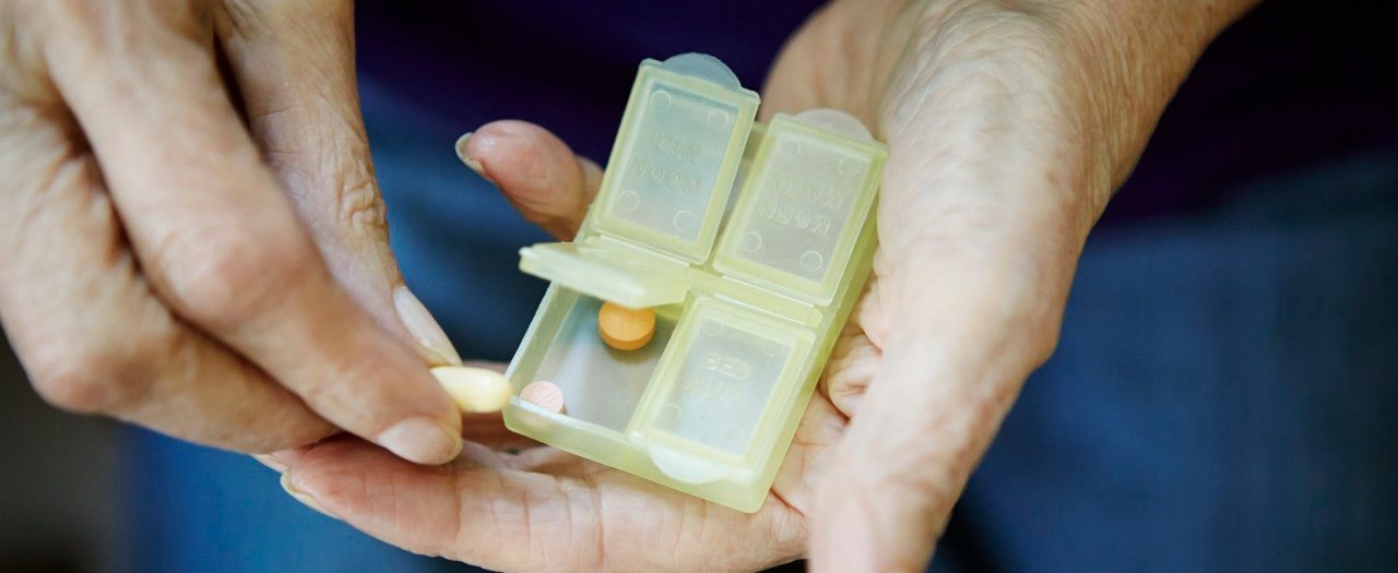 17 Feb 2014 --- Close up of 82 year old senior woman's hand with pill box --- Image by © Kathleen Finlay/Corbis