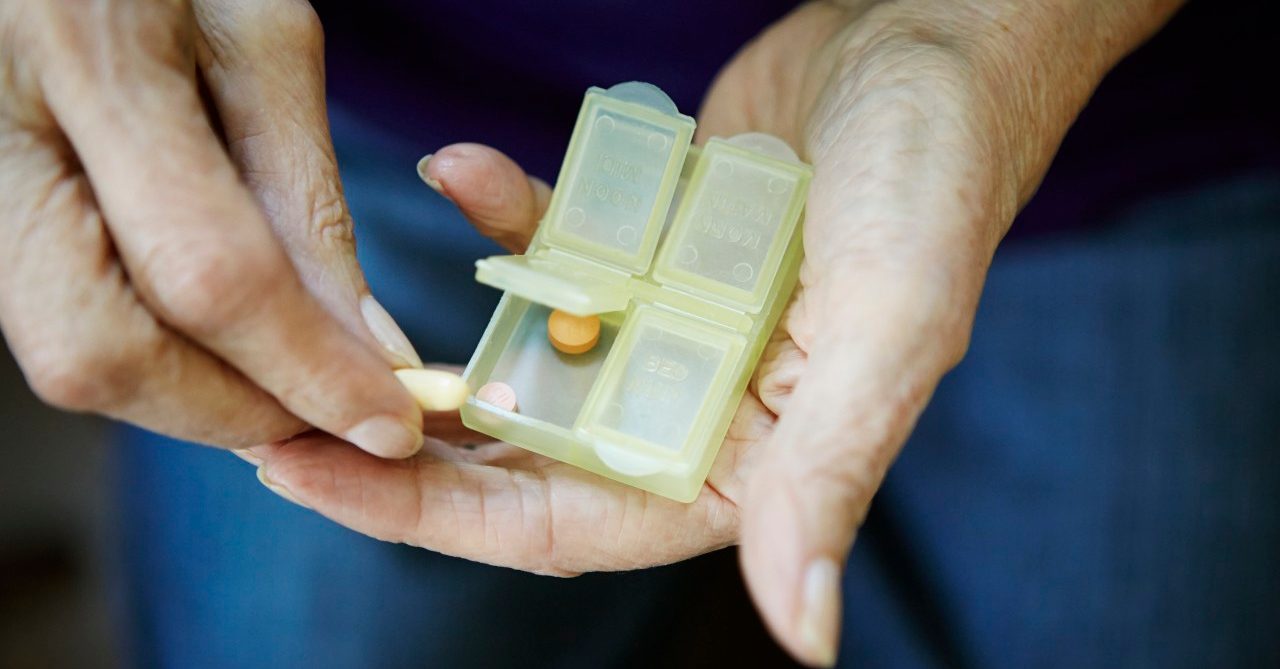 17 Feb 2014 --- Close up of 82 year old senior woman's hand with pill box --- Image by © Kathleen Finlay/Corbis