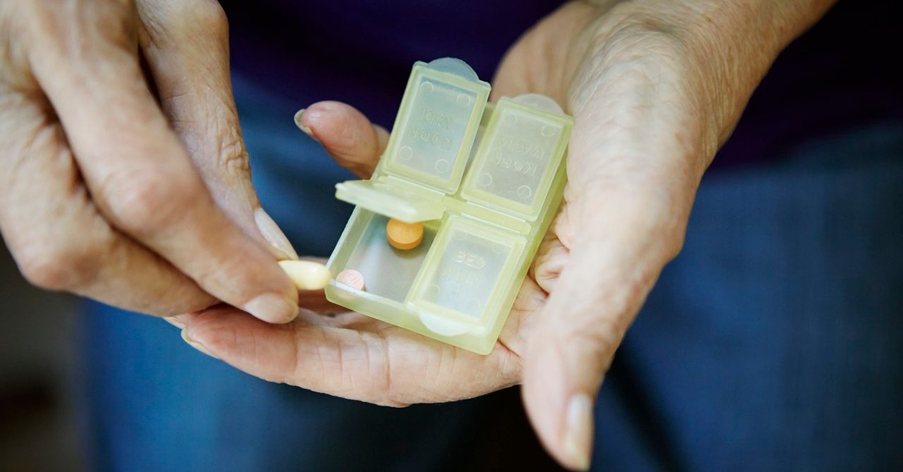 0042-11-30T00:00:00.000Z 17 Feb 2014 --- Close up of 82 year old senior woman's hand with pill box --- Image by © Kathleen Finlay/Corbis