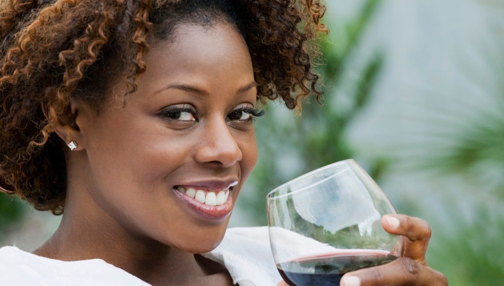 0042-11-30T00:00:00.000Z African American woman drinking red wine --- Image by © Inti St. Clair/Blend Images/Corbis