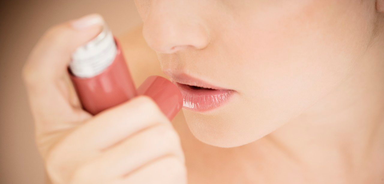 0042-11-30T00:00:00.000Z Female asthma sufferer using an inhaler --- Image by © I Love Images/Corbis