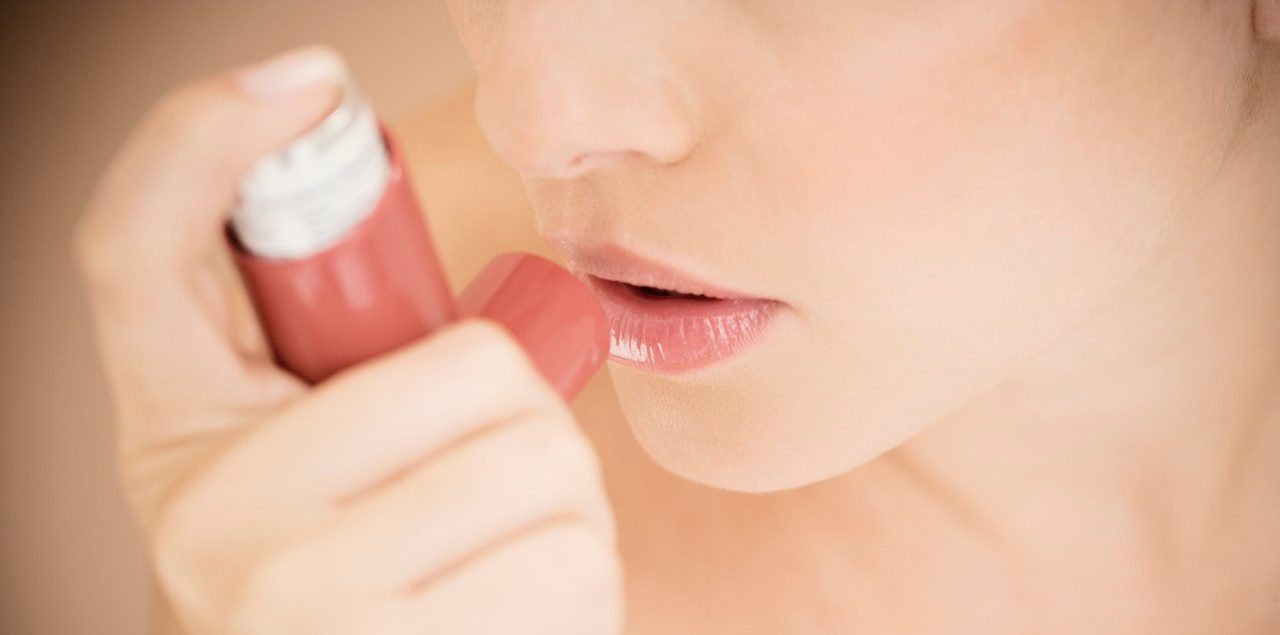 0042-11-30T00:00:00.000Z Female asthma sufferer using an inhaler --- Image by © I Love Images/Corbis