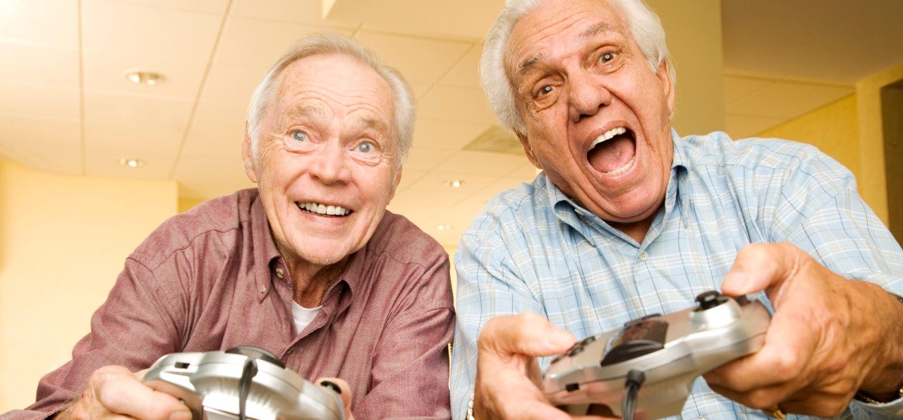 Two elderly men playing a video game --- Image by © I Love Images/Corbis