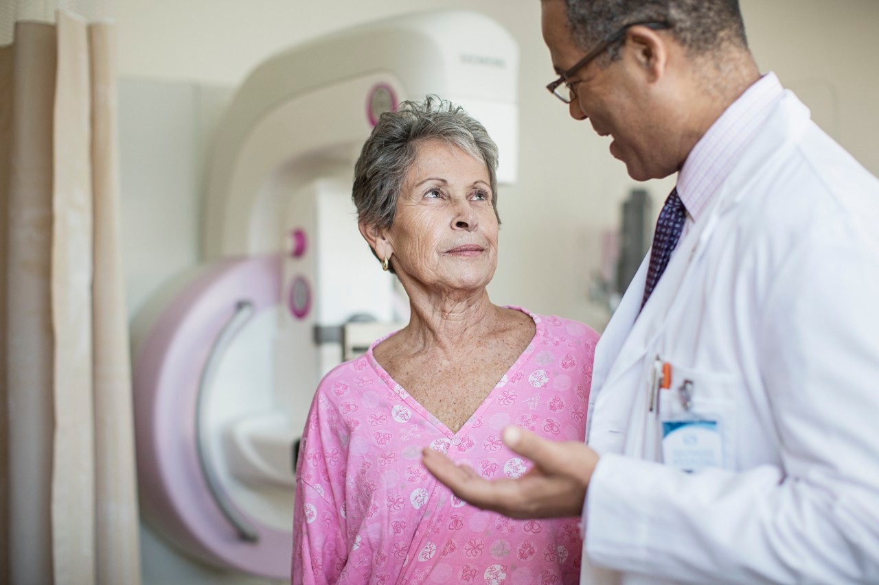 Doctor talking with patient --- Image by © Isaac Lane Koval/Corbis