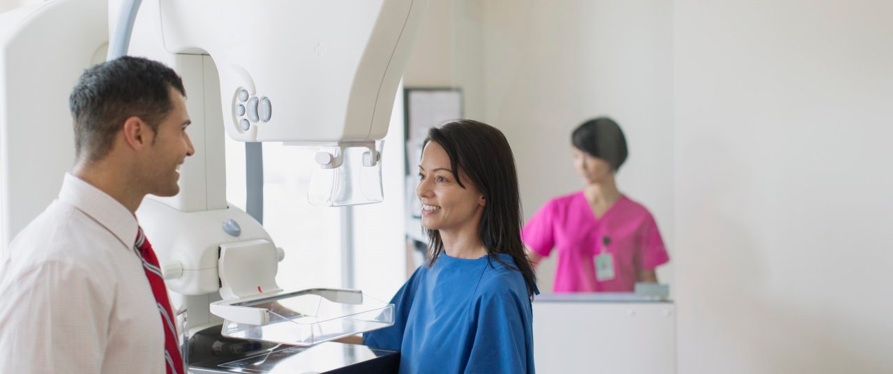 0042-11-30T00:00:00.000Z 17 Jul 2012 --- Doctor talking with patient about mammograph procedure. --- Image by © Hero Images/Corbis