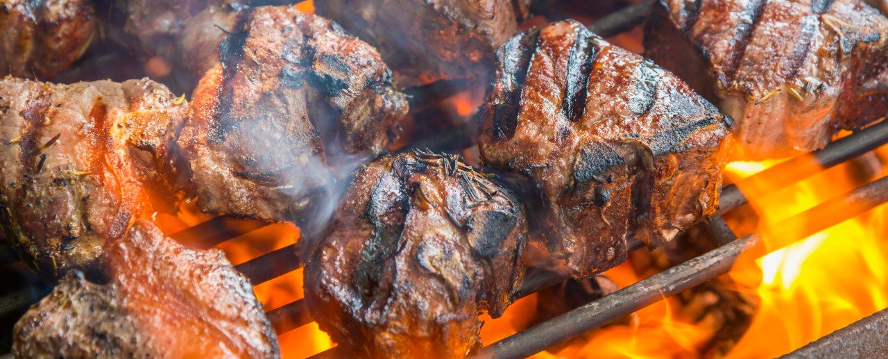 01 May 2013 --- Grilling T bone steaks on barbecue, close up --- Image by © André Babiak/Westend61/Corbis