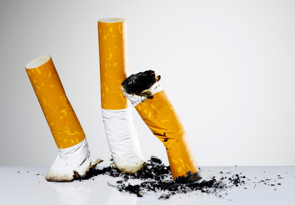Studio shot of cigarette butts --- Image by © Pulse/Corbis
