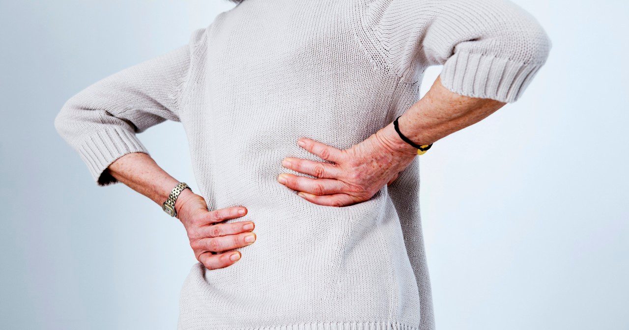 22 Apr 2013 --- Lower back pain in elderly person --- Image by © B. Boissonnet/BSIP/Corbis