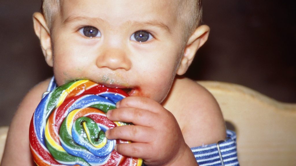 0042-11-30T00:00:00.000Z Baby Eating a Big Lollipop --- Image by © KG-Photography/Corbis