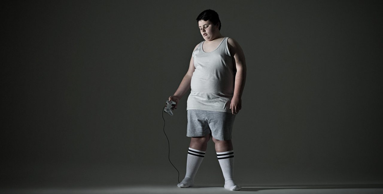 Boy Holding Video Game Controller --- Image by © Image Source/Corbis