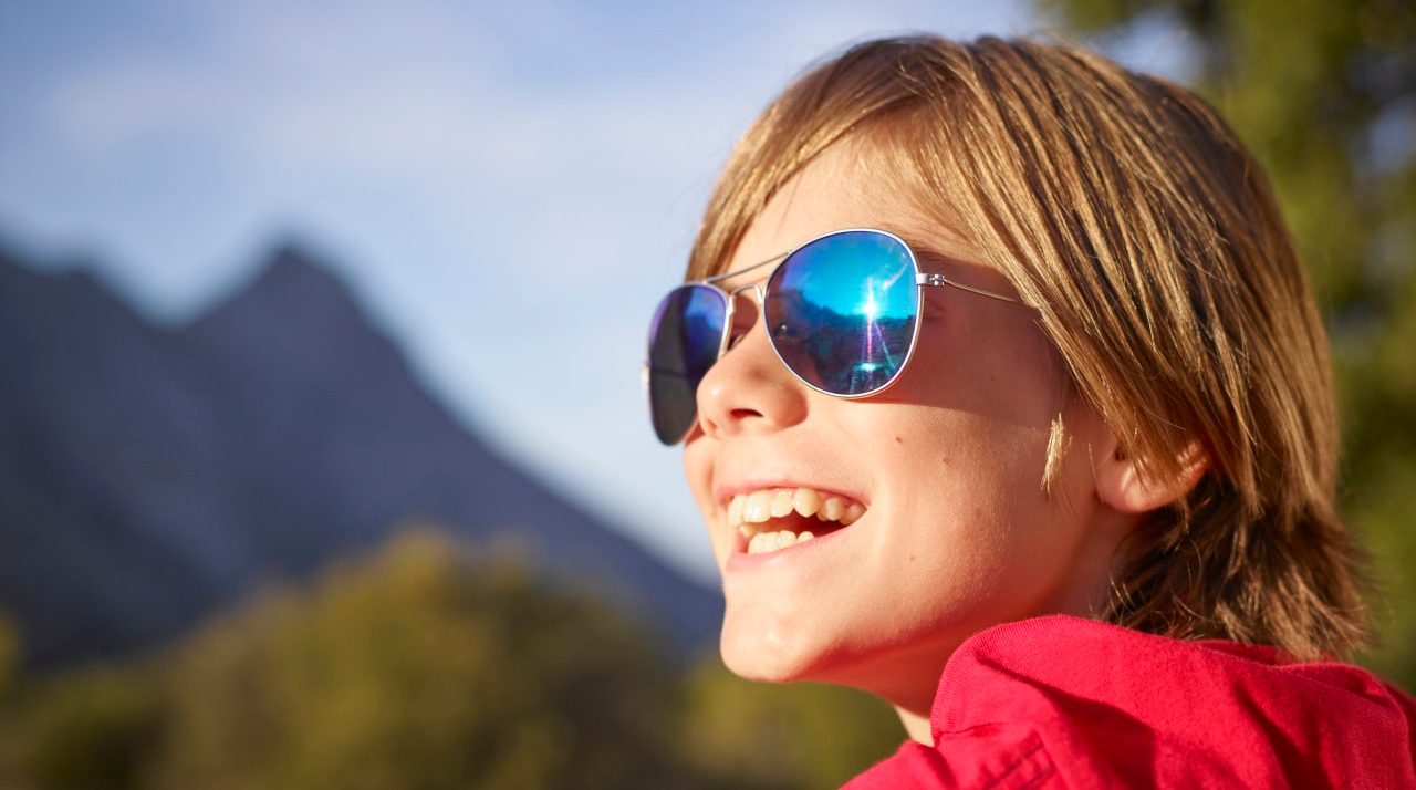 24 Aug 2014, Mallorca, Spain --- Close up portrait of boy in landscape, Majorca, Spain --- Image by © Adrian Weinbrecht/Corbis