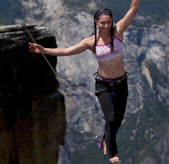 28 Jul 2011, Yosemite National Park, California, USA --- Emily Sukiennik walking a highline above the Yosemite Valley floor at Taft Point --- Image by © Jared Alden/www.auroraphotos.com/Corbis