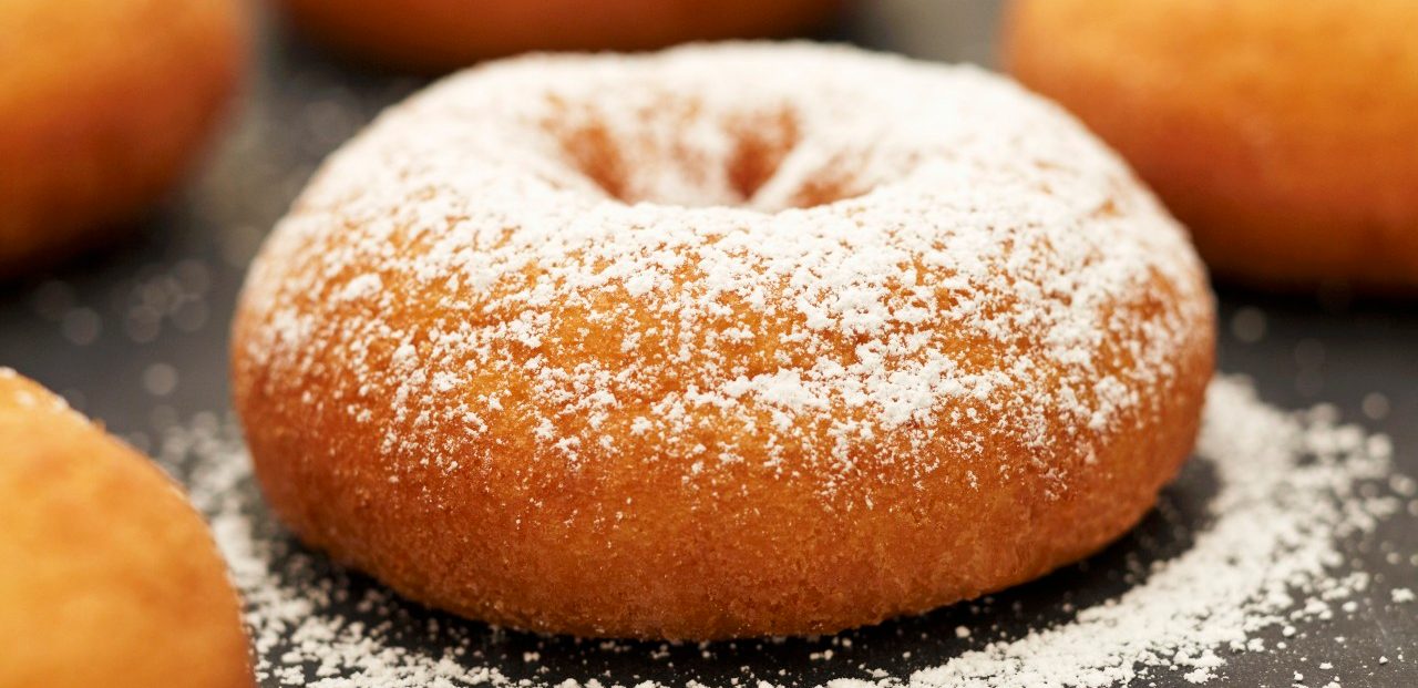 Old Fashioned Donuts; One with Powdered Sugar --- Image by © the food passionates/Corbis
