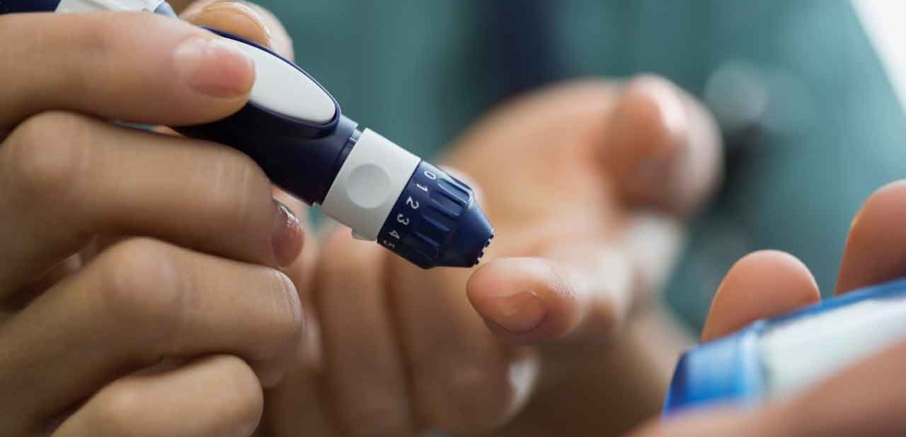 Close up of a diabetic testing blood sugar