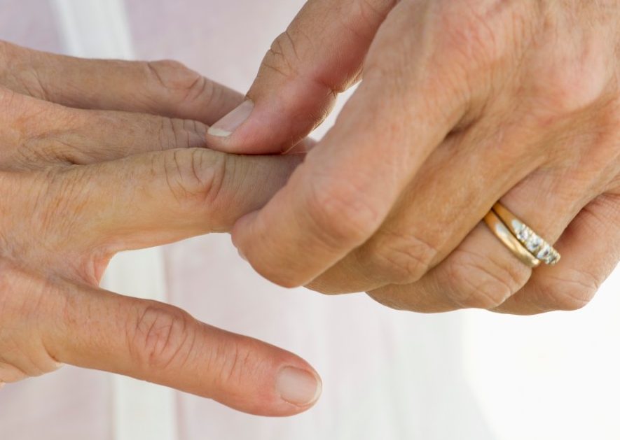 0042-11-30T00:00:00.000Z Senior woman rubbing knuckles, cropped --- Image by © Frederic Cirou/PhotoAlto/Corbis