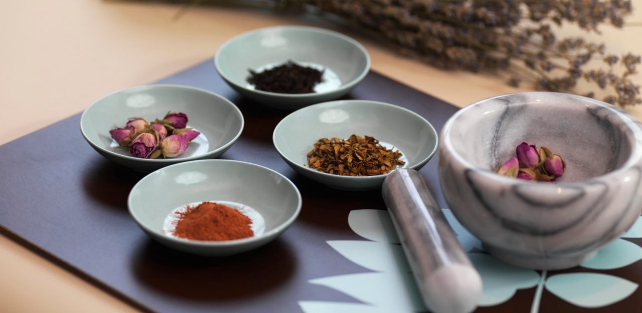 Mortar and Pestle with Dried Herbs --- Image by © Radius Images/Corbis