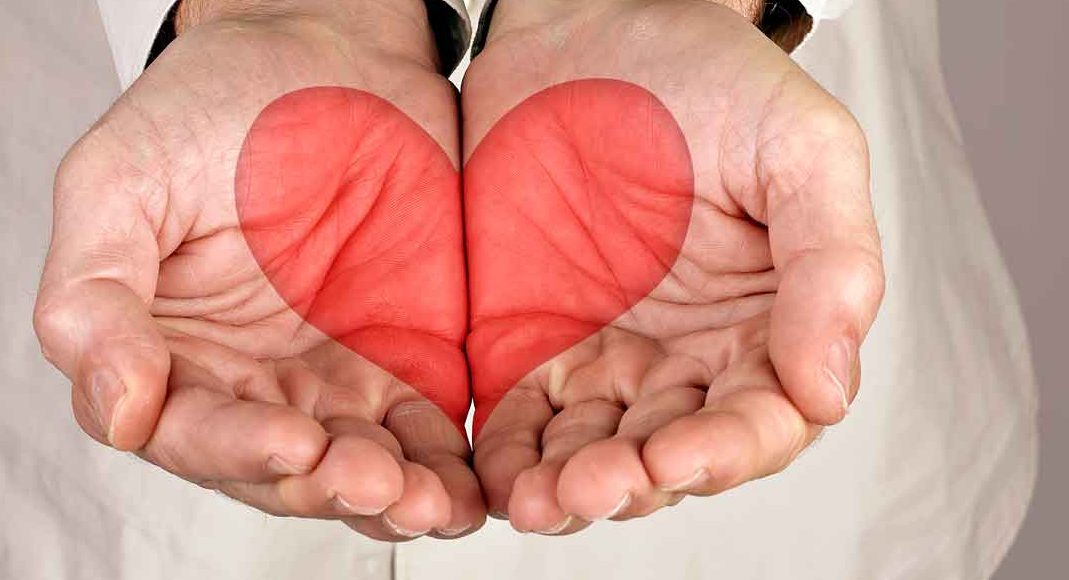 Man holding a heart in his hands