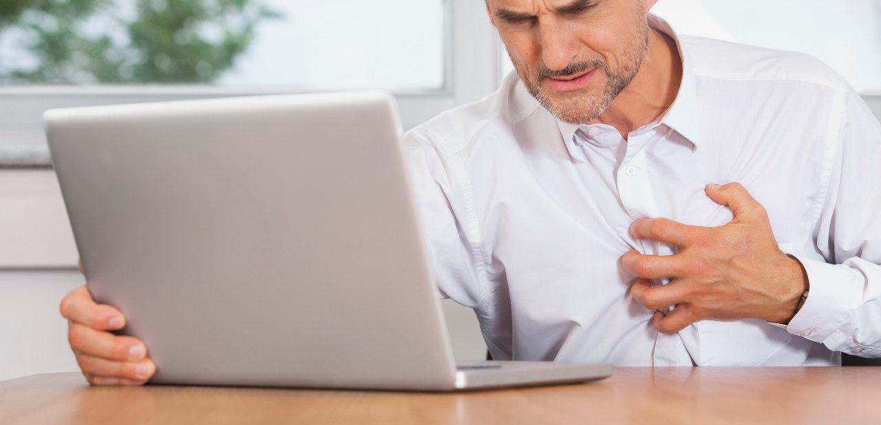 31 Aug 2014 --- Man office stress heart attack burnout anxiety --- Image by © Chris Walsh/Corbis