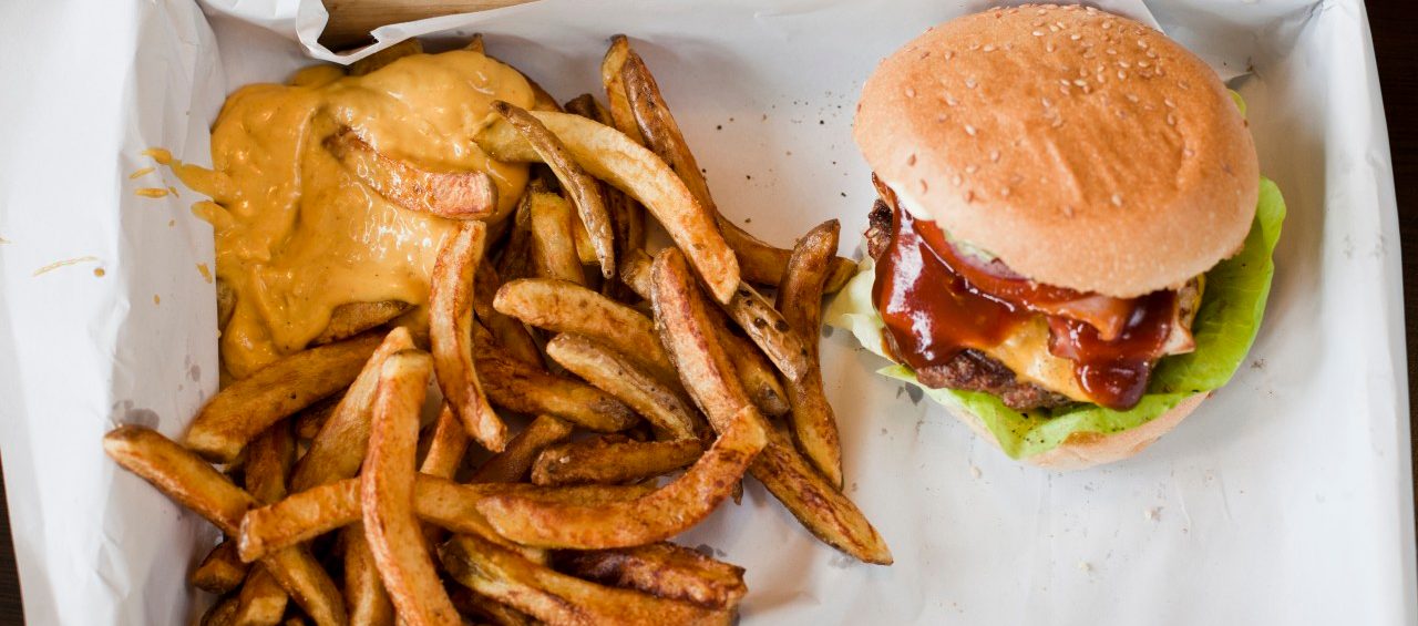 14 May 2014 --- Box with hamburger and French Fries with sauce --- Image by © Felix Eisenmeier/Westend61/Corbis