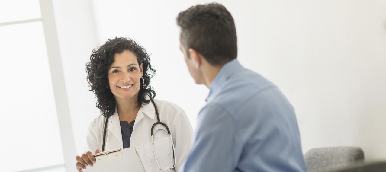 03 Jun 2014 --- Doctor talking with patient --- Image by Â© Tetra Images/Corbis