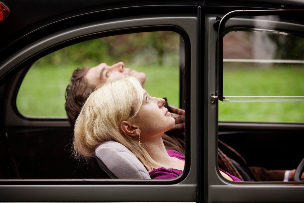 26 Sep 2012 --- Couple relaxing in old car --- Image by © Cavan Images/Corbis