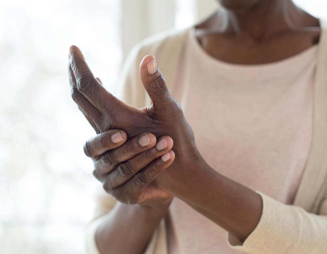 1141574089 Mature woman with painful hand.