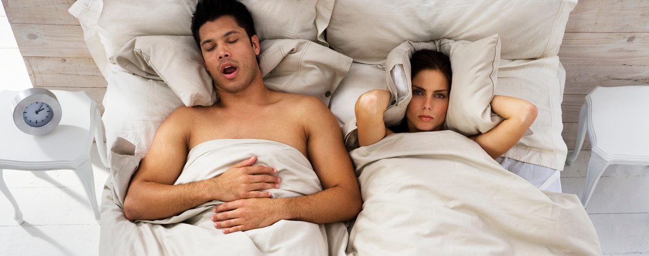 0042-11-30T00:00:00.000Z Woman Trying to Sleep While Man Snores --- Image by © Roy McMahon/Corbis