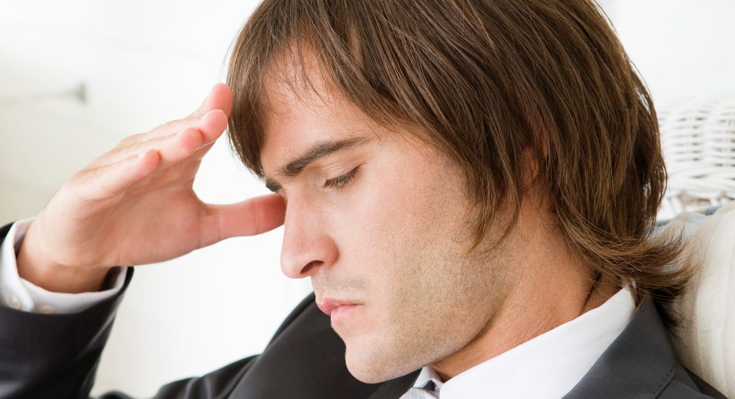 0042-11-30T00:00:00.000Z Close-up of a man suffering from a headache --- Image by © Fabrice Lerouge/Onoky/Corbis