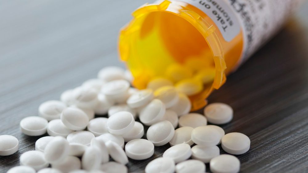 10 Apr 2012 --- White pills spilled on table. --- Image by © Hero Images/Corbis