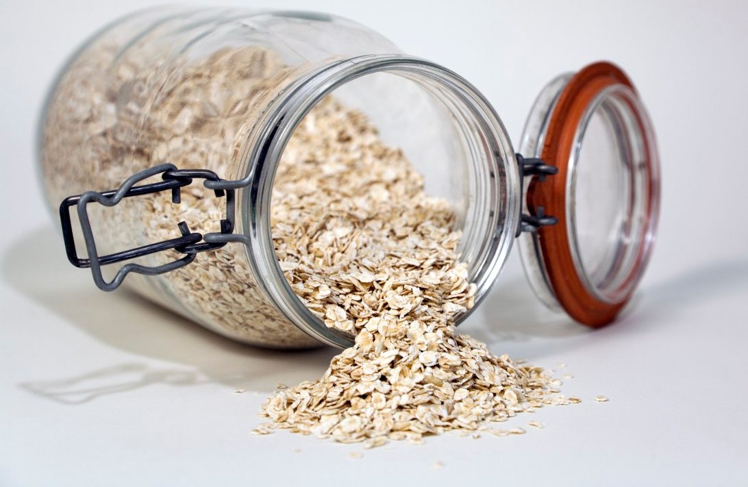 USA --- Rolled oats spilling from a glass jar --- Image by © 145/Snap Decision/Ocean/Corbis