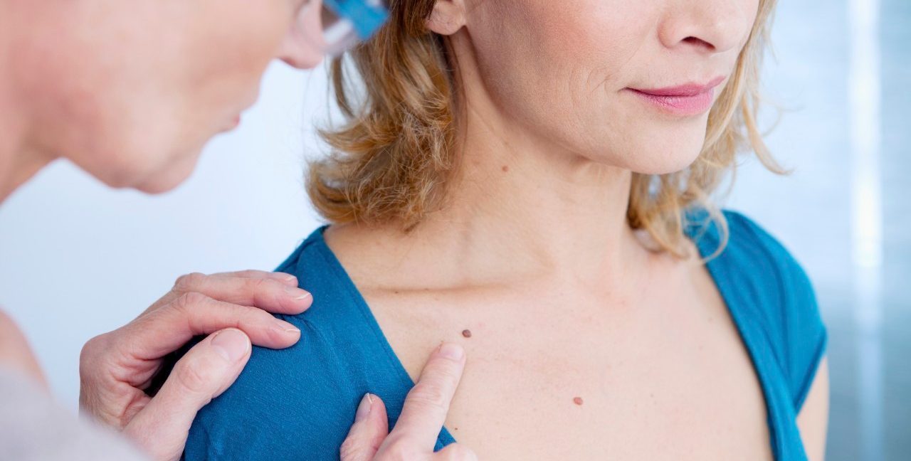 0042-11-30T00:00:00.000Z 07 Mar 2014 --- Doctor examining the upper chest of a patient. --- Image by © B. BOISSONNET / BSIP/BSIP/Corbis