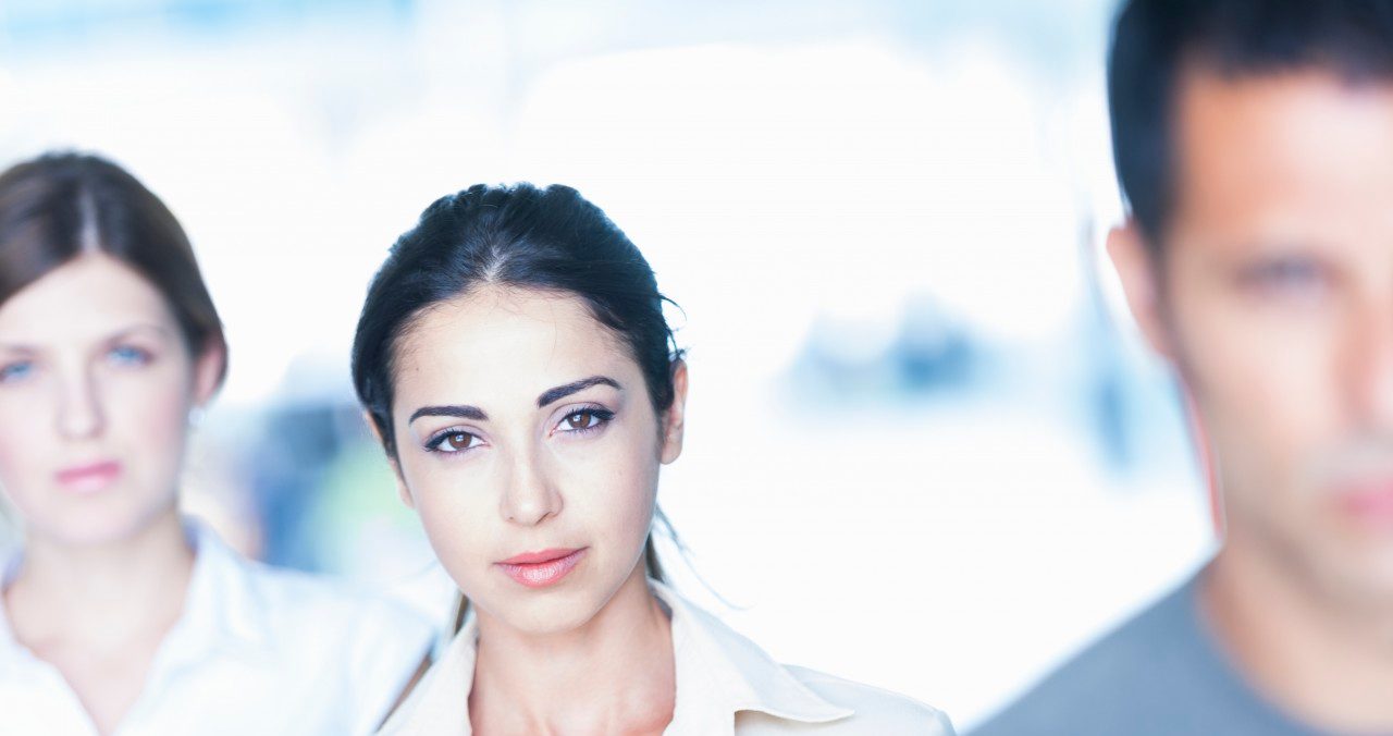 0042-11-30T00:00:00.000Z Smart-looking businesswoman with colleagues --- Image by © Corbis
