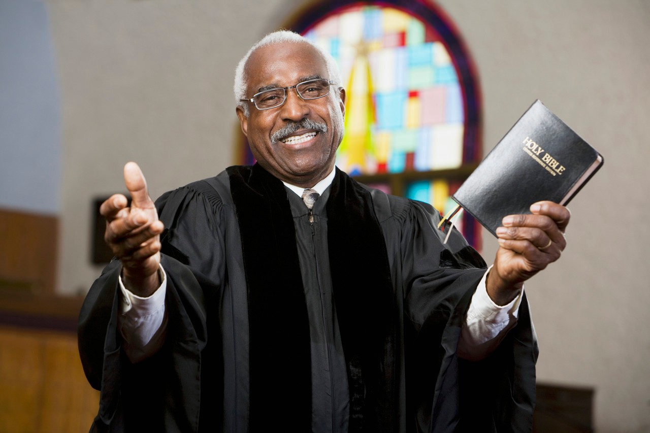 African American Reverend preaching in church --- Image by © Hill Street Studios/Blend Images/Corbis