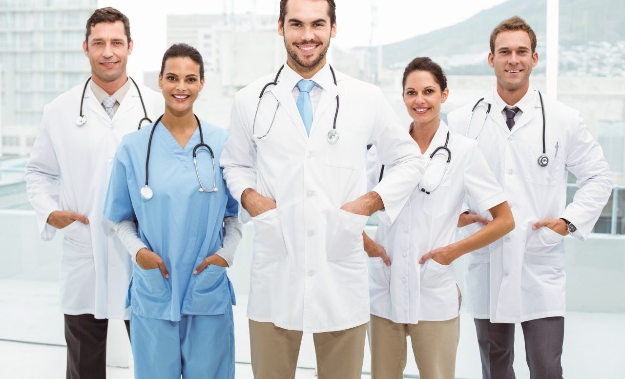 08 May 2014 --- Portrait of confident doctors with hands in pockets at medical office --- Image by © Wavebreak Media Ltd./Corbis