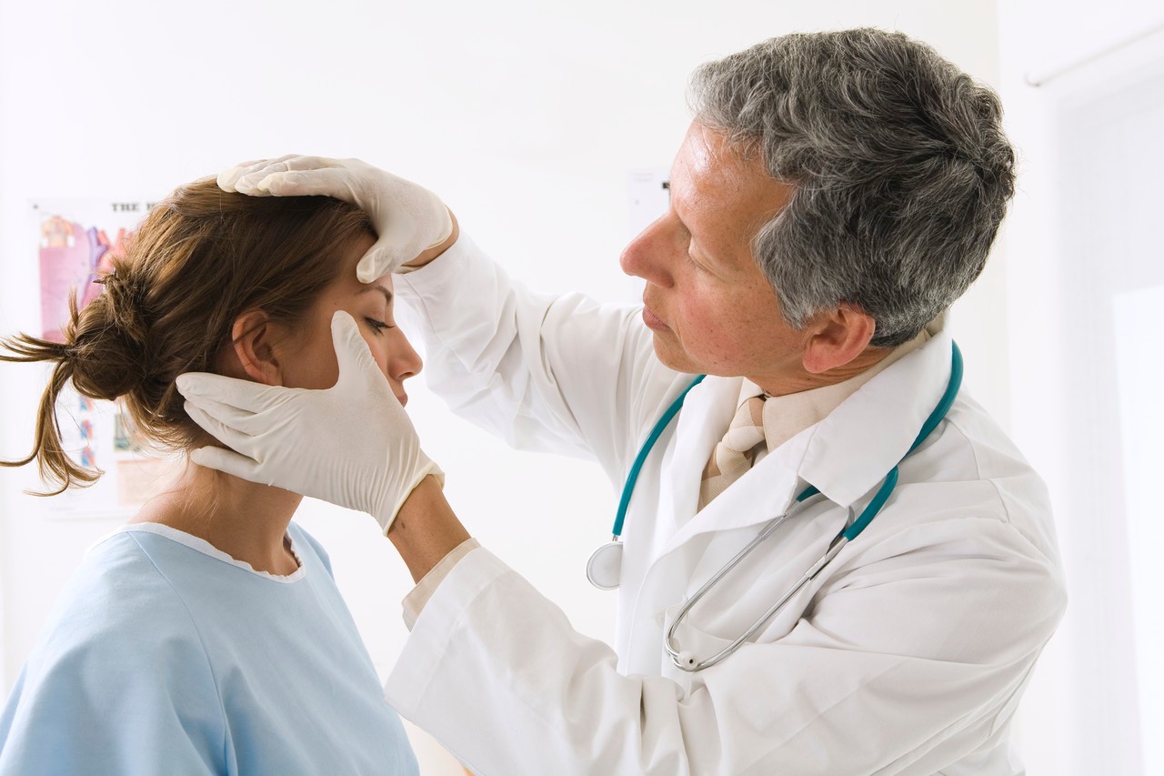 Doctor Examining Woman --- Image by © RCWW, Inc./Corbis