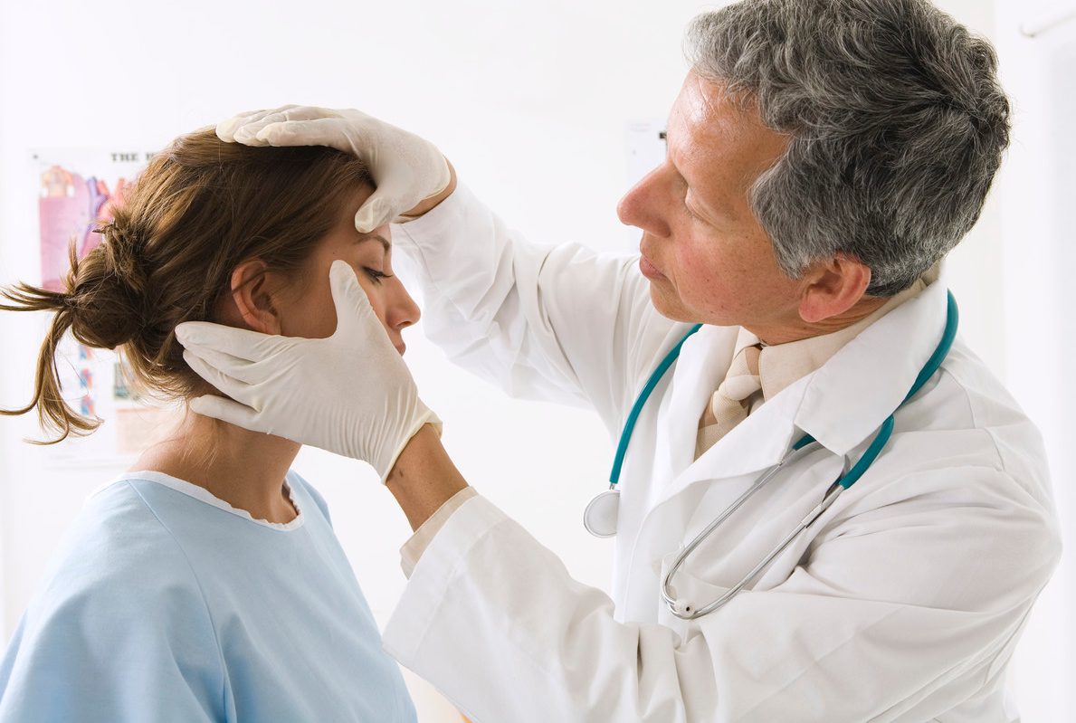Doctor Examining Woman --- Image by © RCWW, Inc./Corbis
