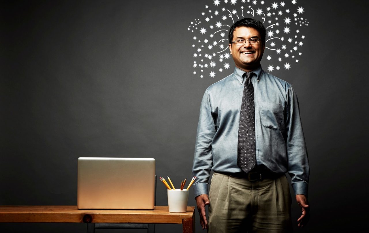 Man laughing with explosive ideas --- Image by © JPM/Corbis