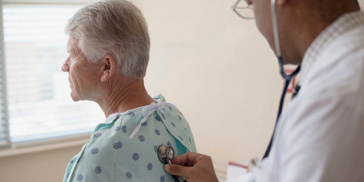 Doctor doing medical examination on patient --- Image by Â© Hiya Images/Corbis