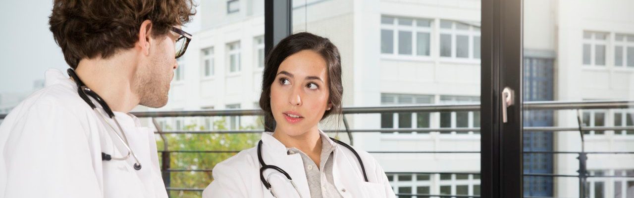 31 Oct 2014 --- Doctors checking documents --- Image by Â© Florian Kuttler/Westend61/Corbis