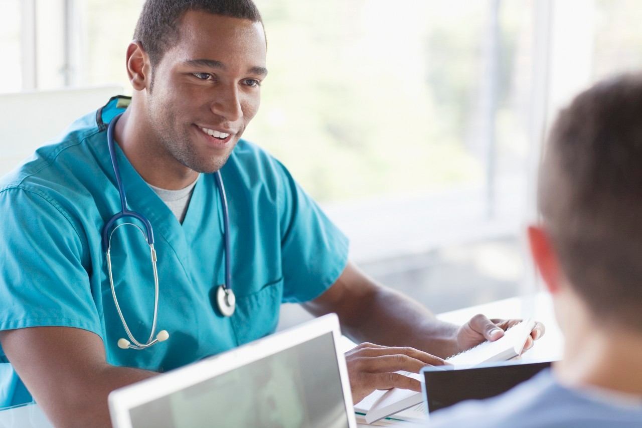 Portrait of two doctors sitting --- Image by © Laura Doss/Corbis