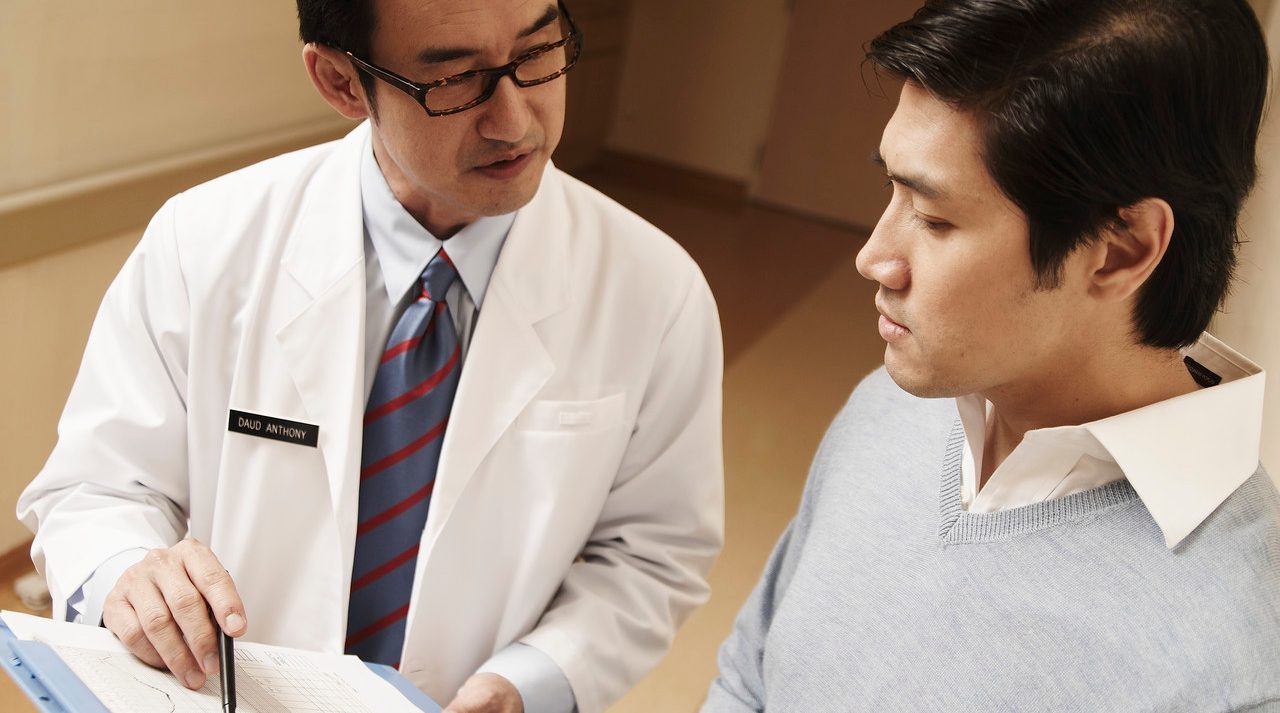 0042-11-30T00:00:00.000Z Doctor Talking with Patient --- Image by © Milk Photographie/Corbis